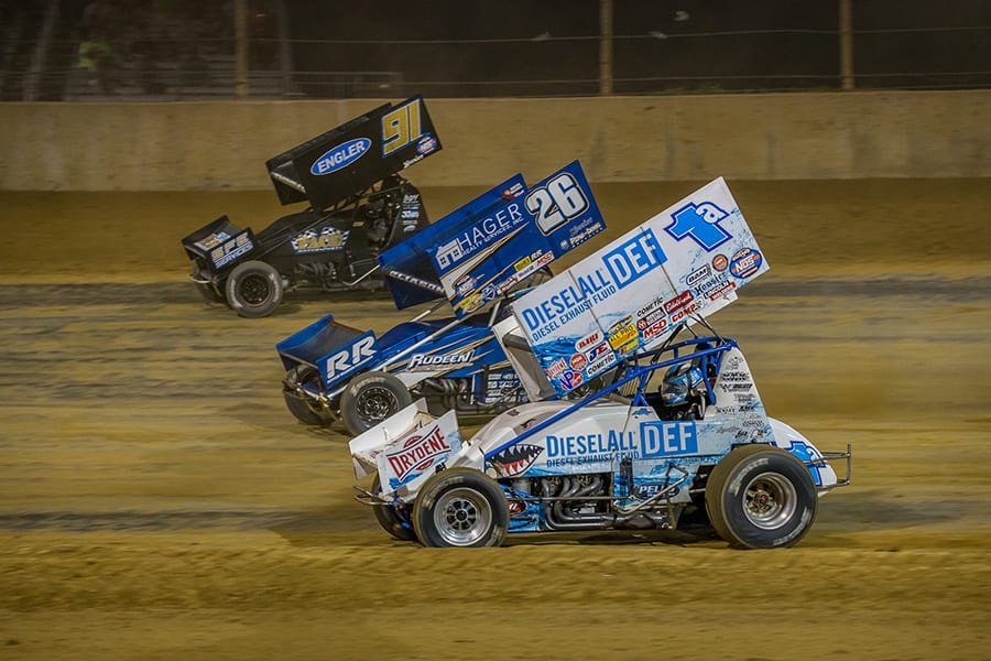 Jacob Allen (1a), Cory Eliason (26) and Cale Thomas race three-wide during Monday's World of Outlaws NOS Energy Drink Sprint Car Series event at Lawrenceburg Speedway. (Dallas Breeze Photo)