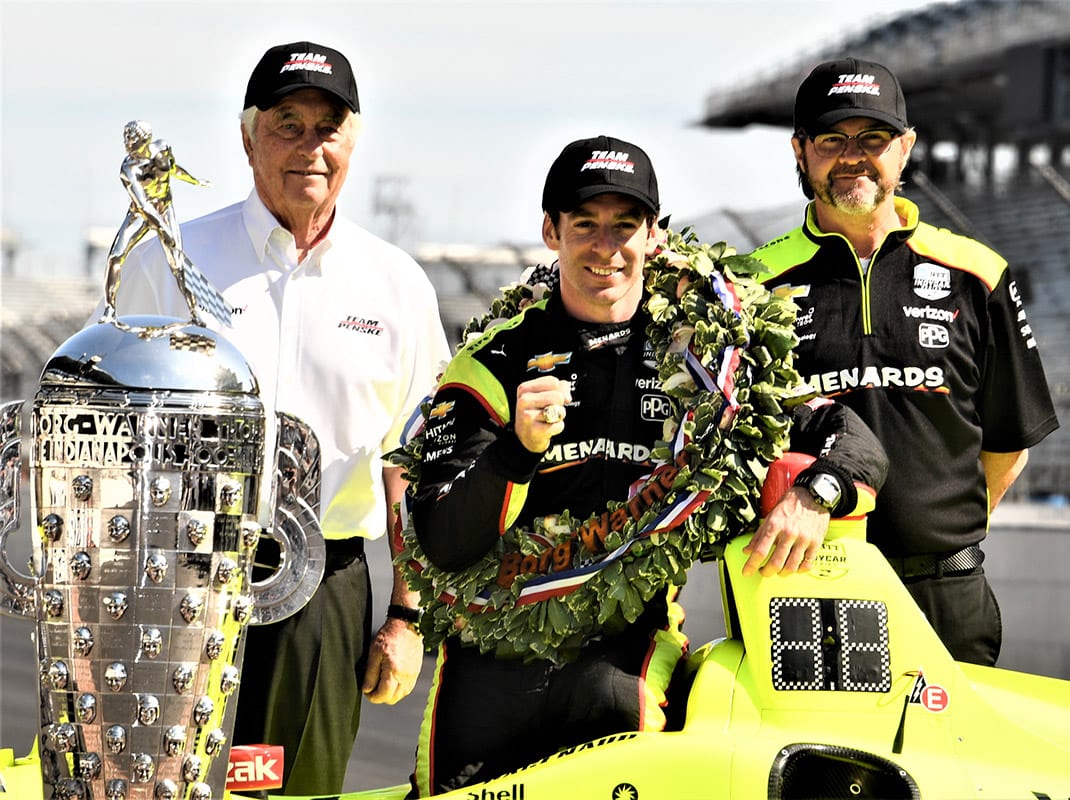 Simon Pagenaud poses with Roger Penkse (left) during the annual Indianapolis 500 winner photo shoot at Indianapolis Motor Speedway. (Al Steinberg Photo)
