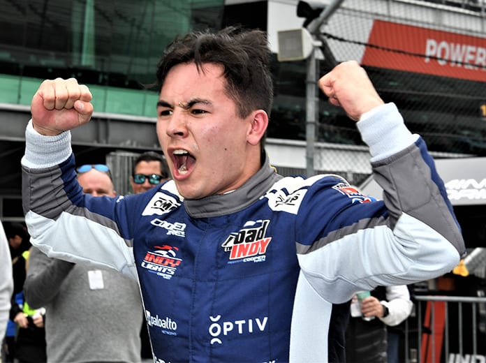 Robert Megennis celebrates his first Indy Lights victory Friday afternoon at Indianapolis Motor Speedway. (Al Steinberg Photo)