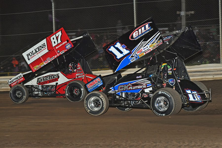 Aaron Reutzel (87) races ahead of Buddy Kofoid during Friday's Ollie's Bargain Outlet All Star Circuit of Champions event at Attica Raceway Park. (Mike Campbell Photo)