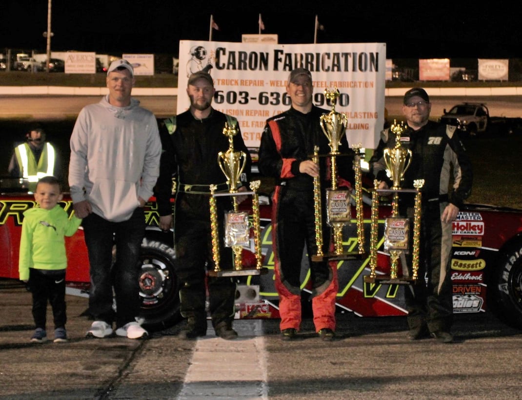 Scott Payea (center) celebrates his victory in the Caron Fabrication Spring Green while flanked by runner-up Quinny Welch (right) and third-place finisher Rich Dubeau (near left). (Mark Alan Sumner photo)