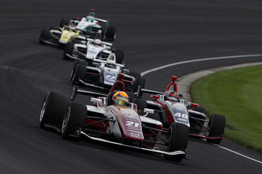 Rinus VeeKay (21) leads the pack during Friday's Freedom 100 at Indianapolis Motor Speedway. (IndyCar Photo)