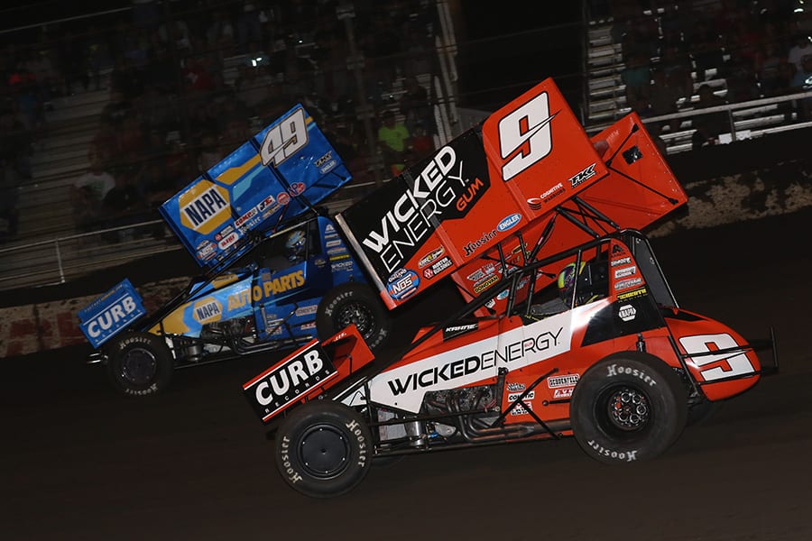 James McFadden (9) chases Brad Sweet during Tuesday's World of Outlaws NOS Energy Drink Sprint Car Series event at Fairbury Speedway. (Brendon Bauman Photo)