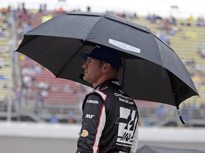 Clint Bowyer watches it rain on Sunday afternoon at Michigan Int'l Speedway. (HHP/Alan Marler Photo)