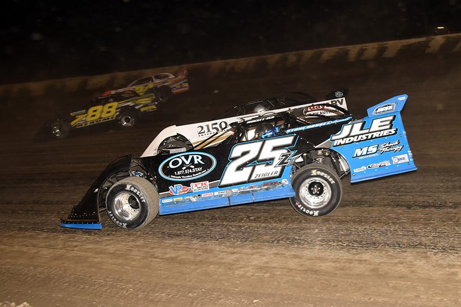 Mason Zeigler (25z) rides the low line while battling in the pack during Friday's Dirt Late Model Dream preliminary event at Eldora Speedway. (Paul Arch Photo)