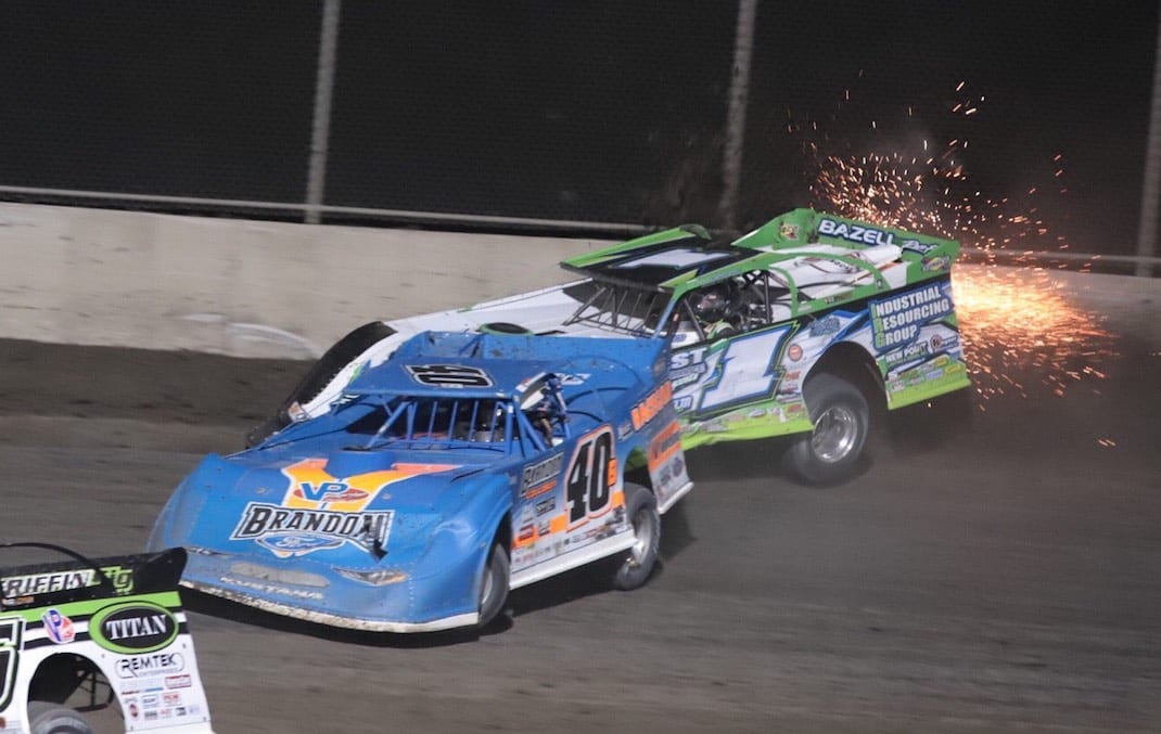 Kyle Bronson (40) slides under Tyler Erb, who bounces off the wall, Tuesday at Tri-City Speedway. (Brad Plant photo)