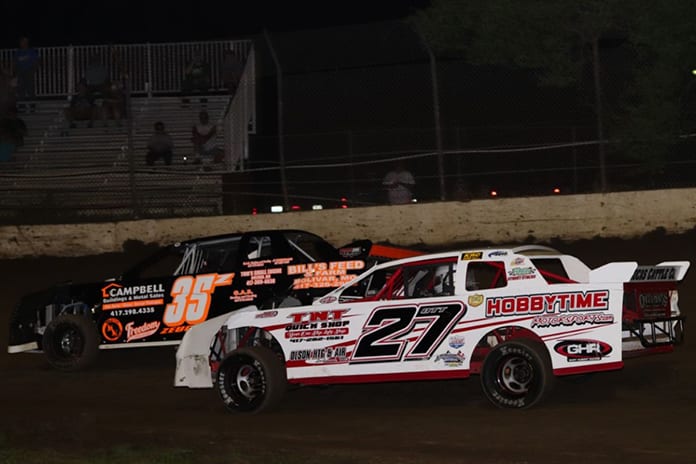 Toby Ott (27) made a low-side pass on Zach Zeugin (35) to claim the $1,500-to-win Street Stock Saturday at Central Missouri Speedway. (Joshua Allee Photo)