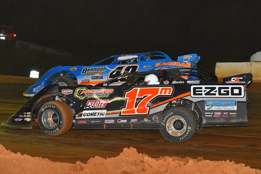 Dale McDowell (17m) races under Kyle Bronson during the Scott Sexton Memorial on Monday at 411 Motor Speedway. (Michael Moats Photo)