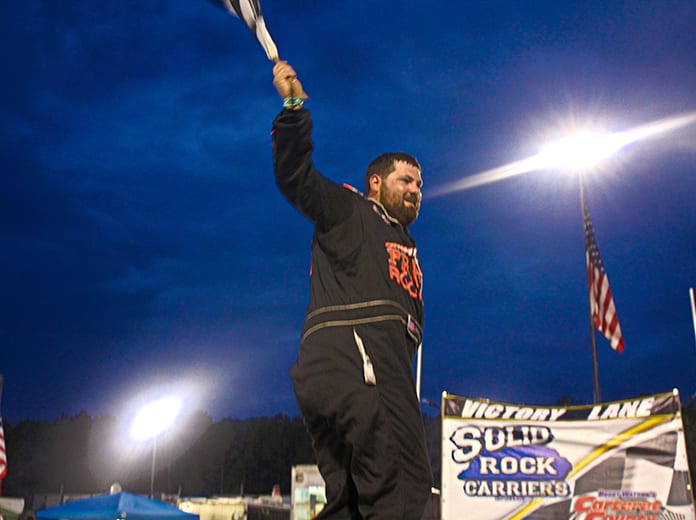 Brandon Clements celebrates in victory lane at Bobby Watson's Carteret County Speedway Saturday. (Andy Marquis Photo)