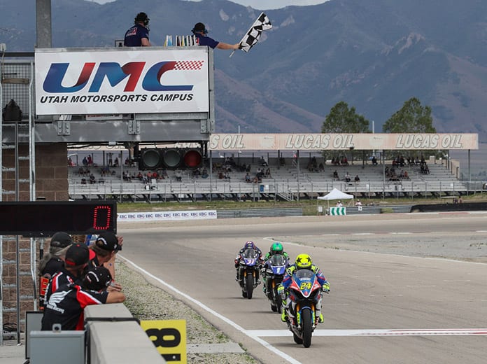 Toni Elias (24) crosses the finish line to win Sunday's MotoAmerica EBC Brakes Superbike race at the Utah Motorsports Campus. (Brian J. Nelson Photo)