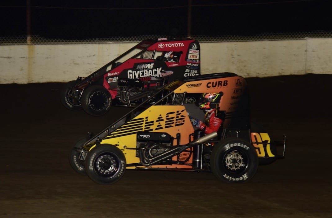 Kyle Larson (97) races under Jesse Colwell at the Dirt Oval at Route 66. (Mark Funderburk photo)