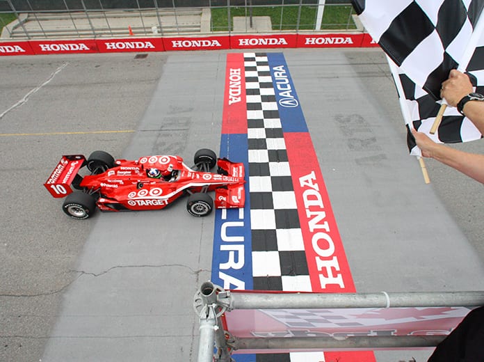 Dario Franchitti takes the checkered flag to win the 2009 Honda Indy Toronto. (IndyCar Photo)