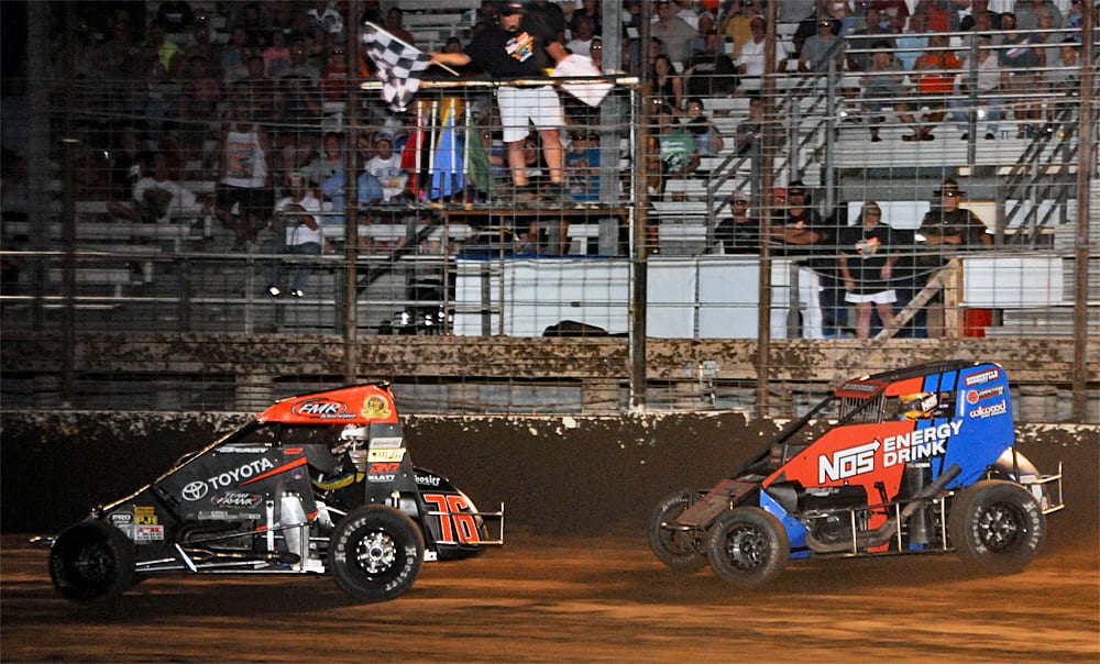 Jason McDougal (76) leads Tyler Courtney under the checkered flag at Jefferson County Speedway. (TWC photo)