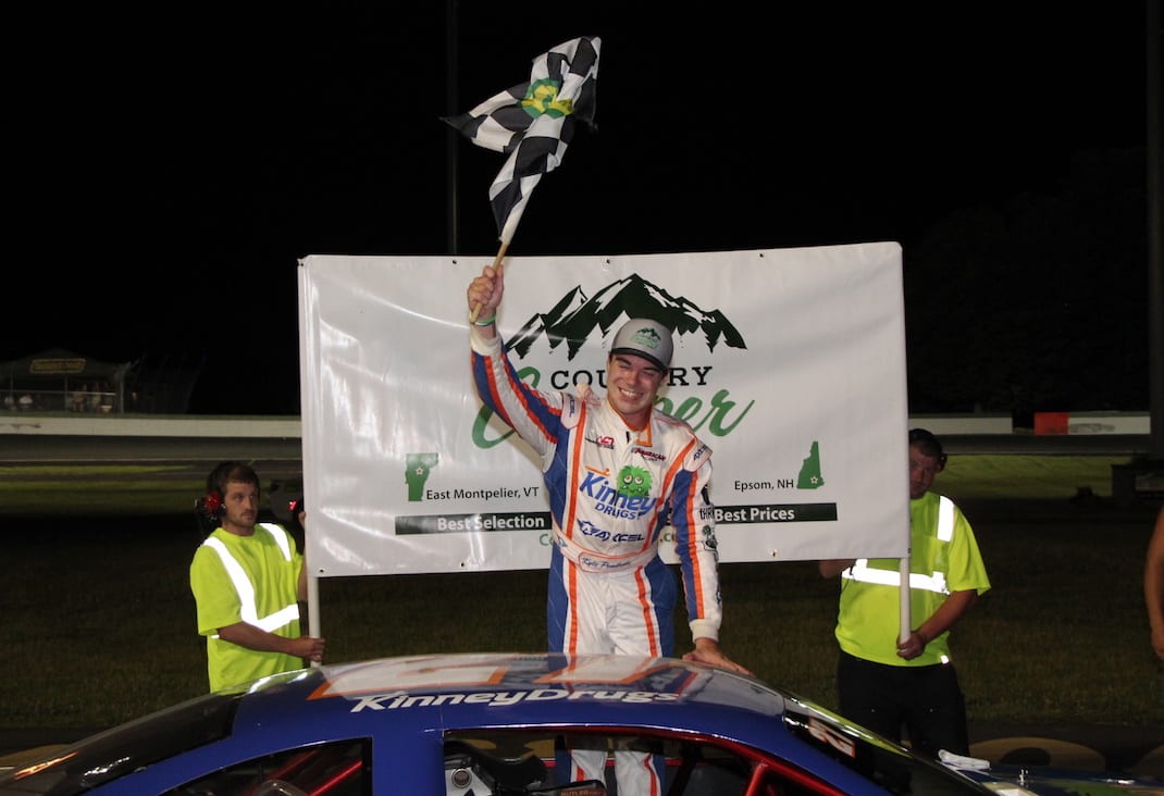 Kyle Pembroke celebrates victory at Thunder Road Int'l Speedbowl. (Alan Ward photo)