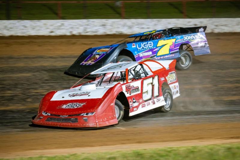 Larry Ferris (51) battles with Ryan Johnson for the lead during Thursday night's ULMA Late Model feature at Lucas Oil Speedway. (Kenny Shaw photo)