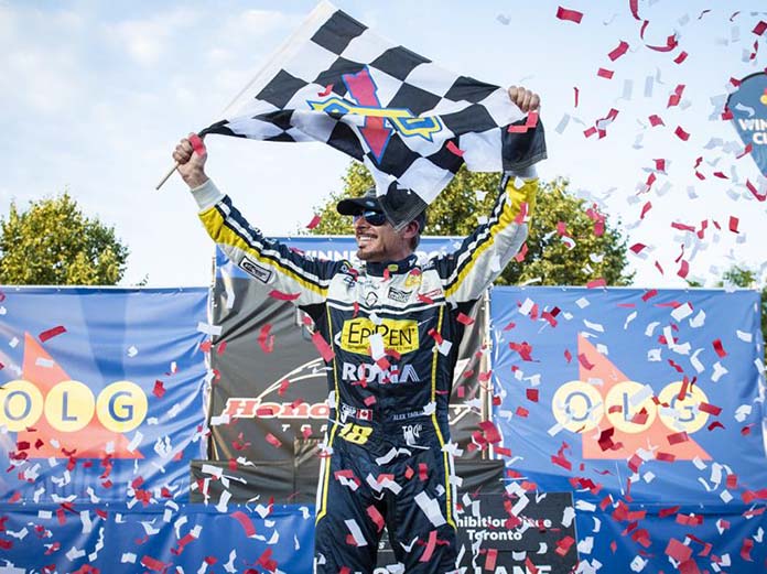 Alex Tagliani celebrates after his victory on the streets of Toronto Saturday afternoon. (NASCAR Photo)