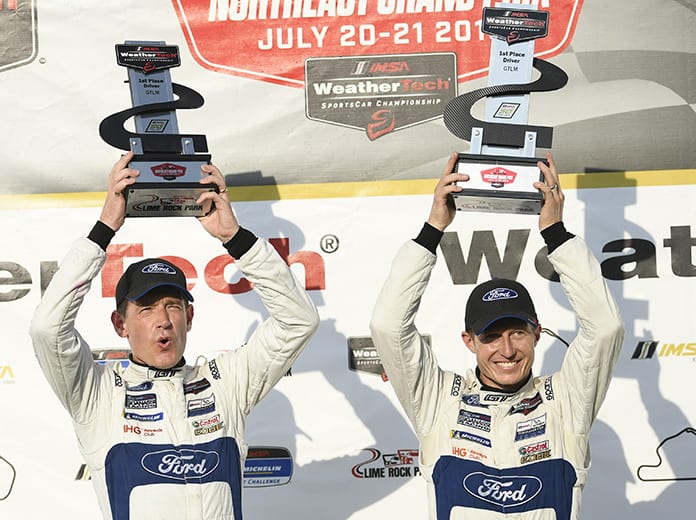 Richard Westbrook (left) and Ryan Briscoe (right) gave the Ford GT and Chip Ganassi Racing their first victory of the season Saturday at Lime Rock Park. (IMSA Photo)