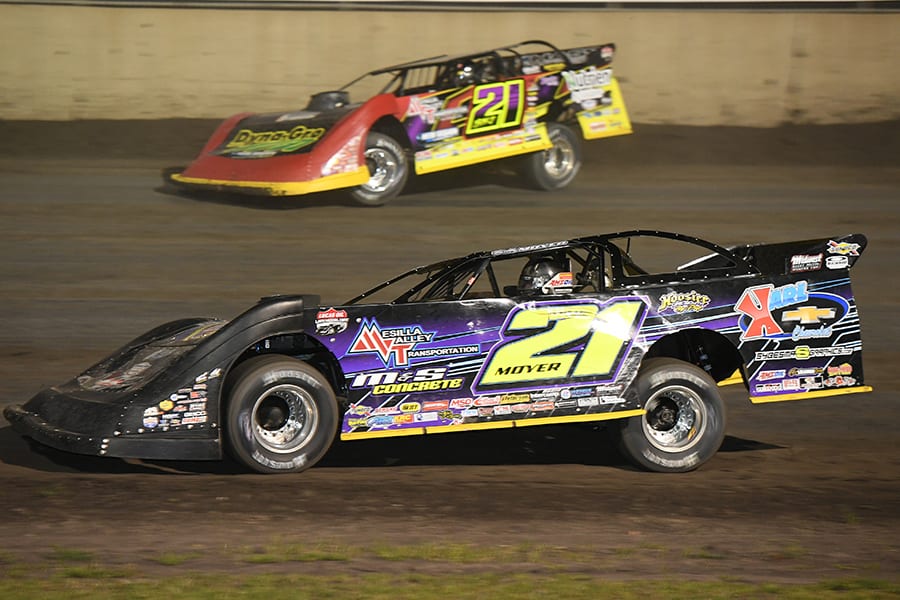 Billy Moyer (21) battles to the inside of his son, Billy Moyer Jr., during Thursday's Lucas Oil Late Model Dirt Series feature at Tri-City Speedway. (Don Figler Photo)