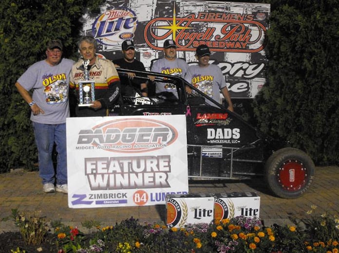 Kevin Olson is joined by car owner Don Kleven and crew after winning the Badger Midget Series Sunday at Angell Park Speedway. (Bob Cruse Photo)