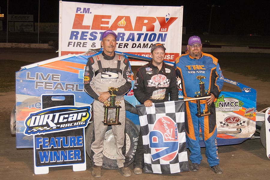 Erick Rudolph (center) shares victory lane with Lance Willix II and Tim Fuller. (DIRTcar photo)
