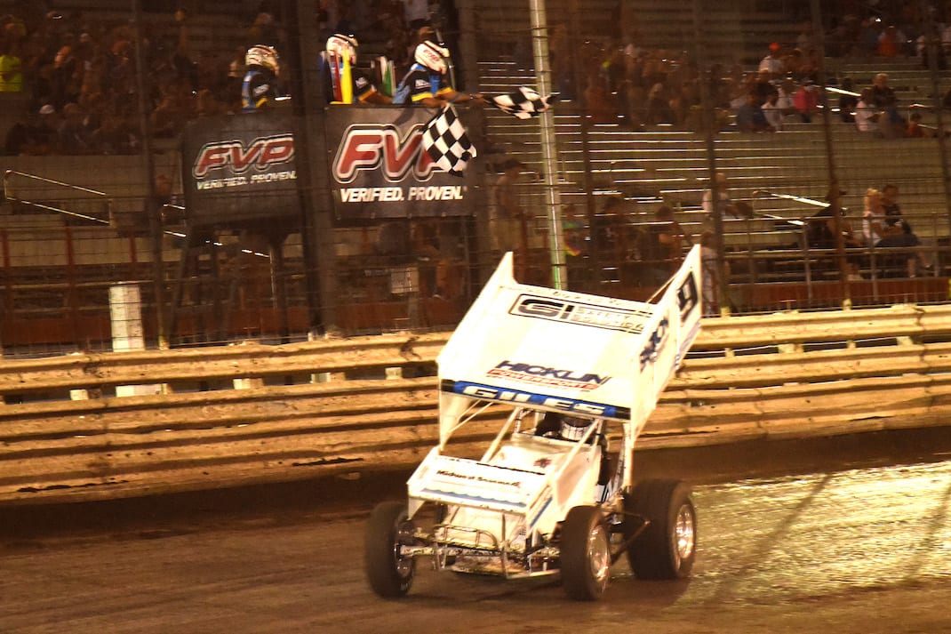 Ryan Giles takes the checkered flag Thursday night at Knoxville Raceway. (Paul Arch photo)