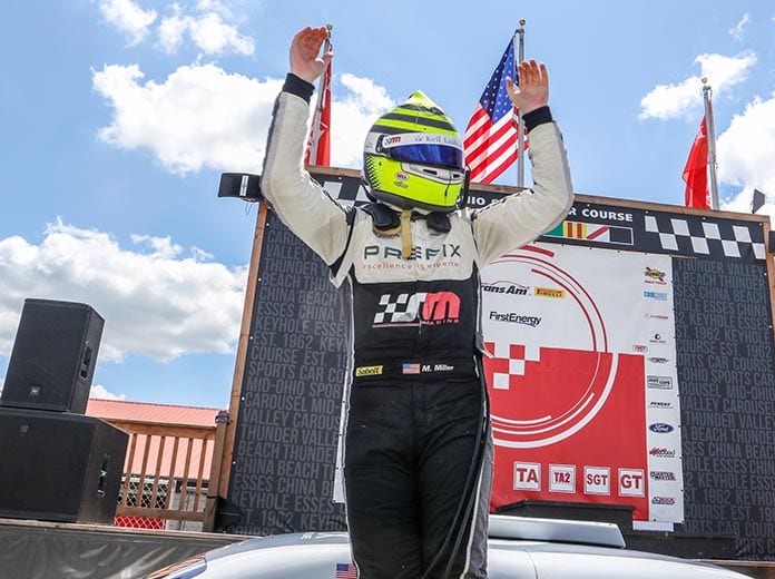 Marc Miller celebrates after winning Saturday's Trans-Am Series TA2 event at the Mid-Ohio Sports Car Course.