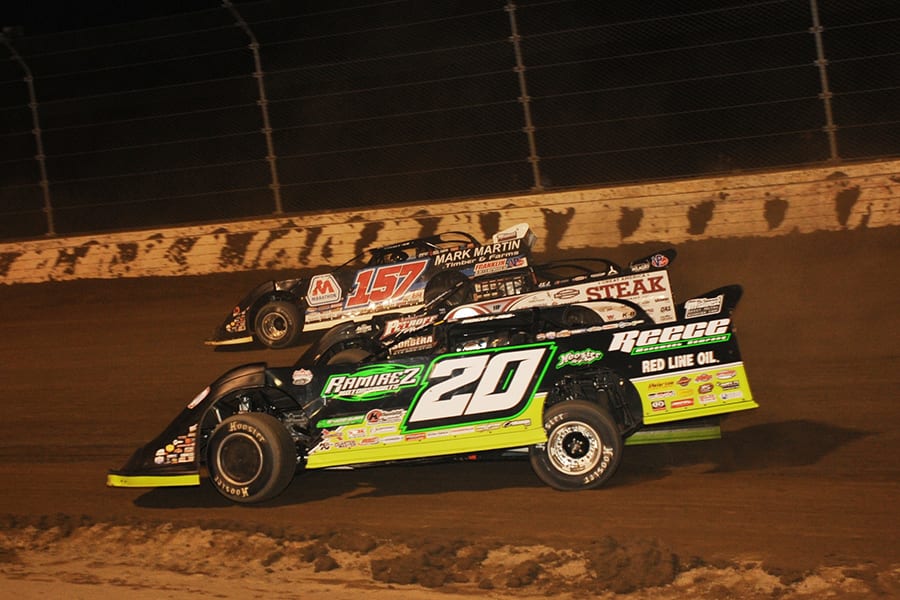 Jimmy Owens (20), Scott Bloomquist (0) and Mike Marlar race three-wide during Saturday's Dirt Million feature at Mansfield Motor Speedway. (Trent Gower Photo)
