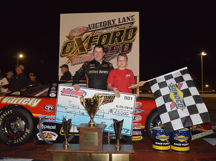 Travis Benjamin shares victory lane with his son after winning the Oxford 250 for the third time on Sunday night. (Ken MacIsaac Photo)