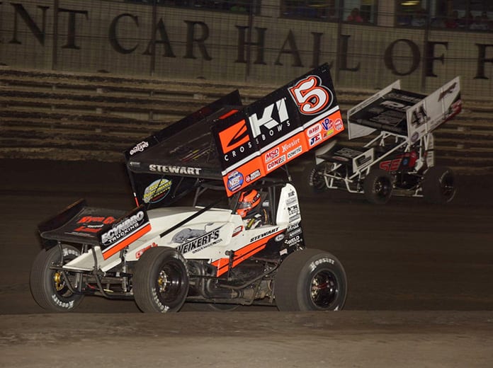 Shane Stewart (5) leads Dominic Scelzi Friday during the Hard Knox feature at Knoxville Raceway. (Mark Funderburk Photo)