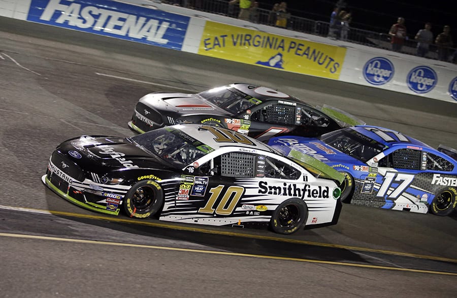 Aric Almirola (10), Ryan Newman (6) and Ricky Stenhouse Jr. battle for position during Saturday's Federated Auto Parts 400 at Richmond Raceway. (HHP/Alan Marler Photo)