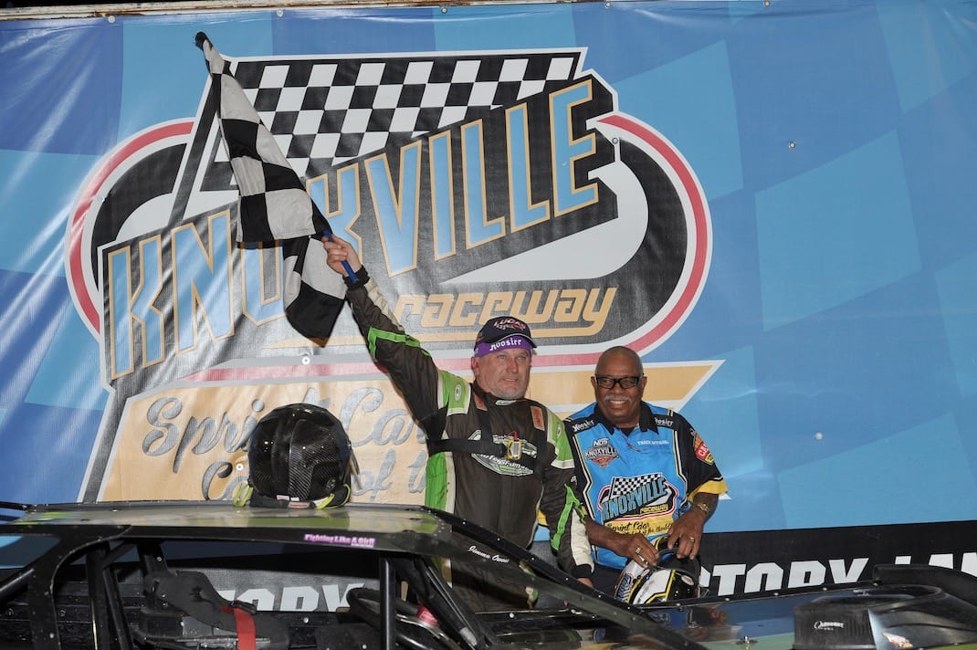 Jimmy Owens in victory lane with flag man Doug Clark. (Knoxville Raceway photo)