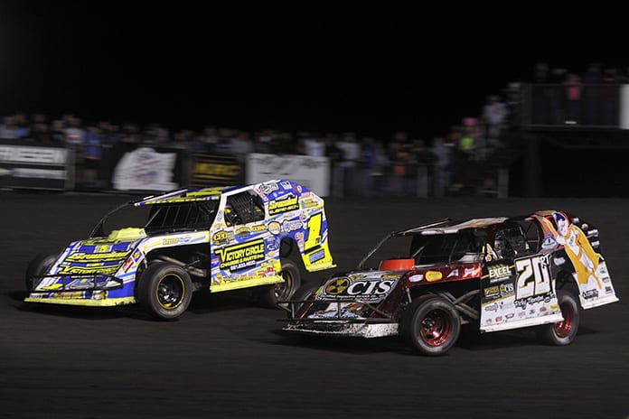 Ethan Dotson (1) battles Ricky Thornton Jr. during the IMCA Super Nationals modified feature Saturday at Boone Speedway. (Shawn Crose Photo)