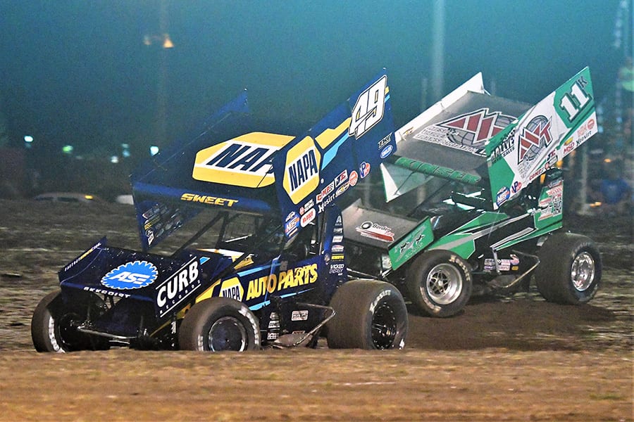 Brad Sweet (49) races ahead of Kraig Kinser during the Gold Cup Race of Champions Saturday at Silver Dollar Speedway. (Tom Parker Photo)