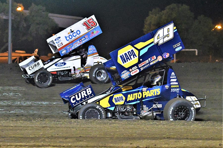 Brad Sweet (49) battles Donny Schatz during the Gold Cup Race of Champions Saturday at Silver Dollar Speedway. (Tom Parker Photo)