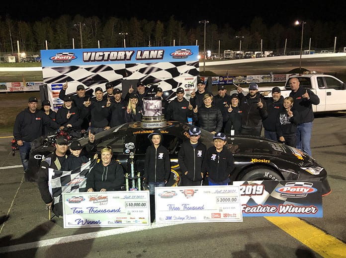 Jonathan Hicken and his team celebrate after winning the Mike Stevens Memorial Saturday at Petty Int'l Raceway.