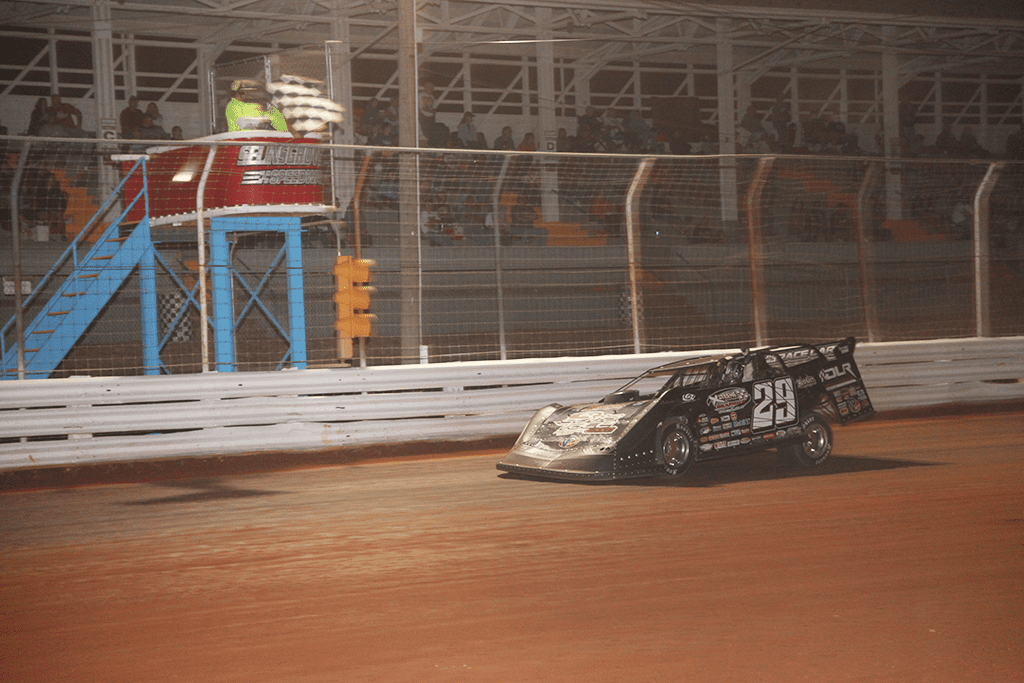 Darrell Lanigan takes the checkered flag at Selinsgrove Speedway. (Rick Neff photo)