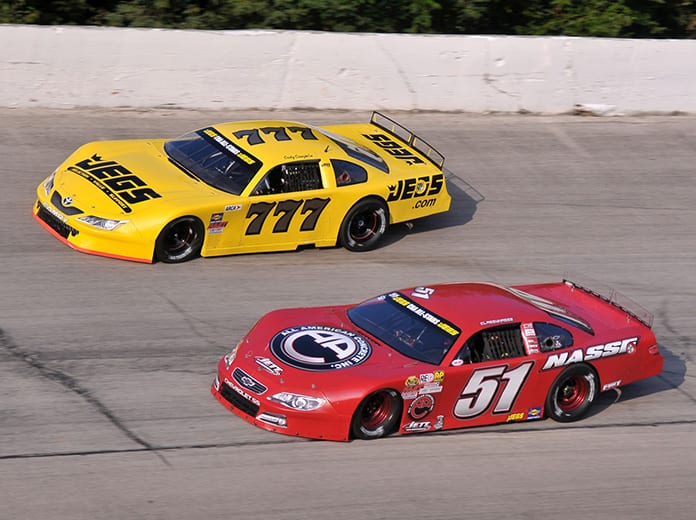 Stephen Nasse (51) passes Cody Coughlin en route to victory Sunday at Winchester Speedway. (Randy Crist Photo)