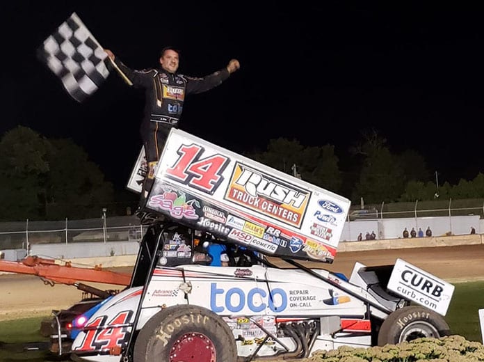 Tony Stewart in victory lane Saturday at the Plymouth Dirt Track. (Dave Olson Photo)