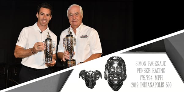 Simon Pagenaud and Roger Penske were presented with their Baby Borg trophies on Monday, with Pagenaud's trophy also featuring a likeness of his dog, Norman.