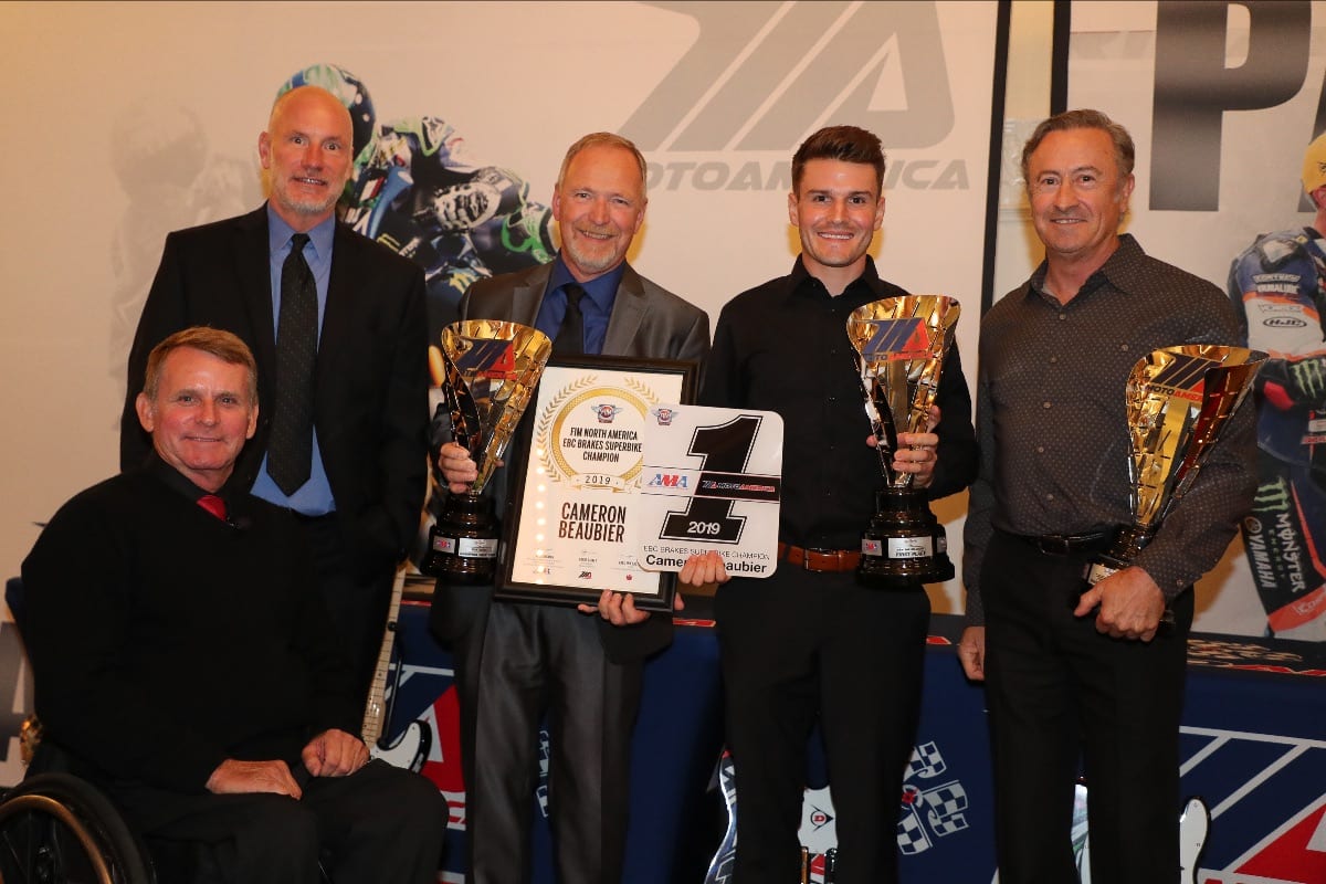 (From left to right) MotoAmerica President Wayne Rainey, AMA Chief Operating Officer Jeff Massey, crew chief Rick Hobbs, Cameron Beaubier and team manager Tom Halverson celebrate Beaubier's Superbike Championship at the Night of Champions. (Brian J. Nelson Photo)