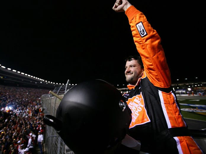 Tony Stewart celebrates in the starter's box after winning the 2006 NASCAR Cup Series Dickies 500 at Texas Motor Speedway. (Getty Images Photo)
