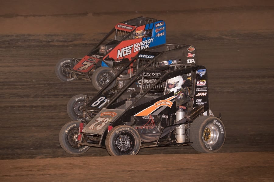 Jake Swanson (73), Dillon Welch (81) and Tyler Courtney go three-wide during the Elk Grove Ford Hangtown 100 at Placerville Speedway. (Devin Mayo photo)