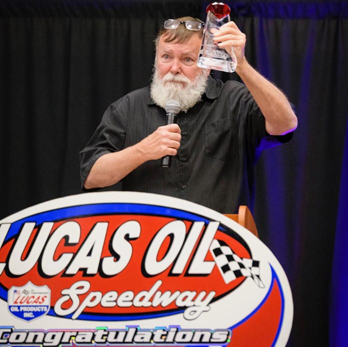 Long-time announcer Kevin Fletcher received the 2019 Forrest Lucas Lifetime Achievement Award at Saturday night's Lucas Oil Speedway Awards Banquet. (Kenny Shaw photo)