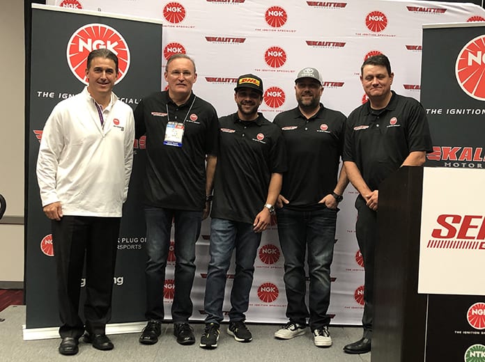 NGK Vice President of Aftermarket Brian Norko, Doug Kalitta, J.R. Todd, Shawn Langdon and Chad Head at NGK Kalitta Motorsports sponsorship announcement during SEMA.