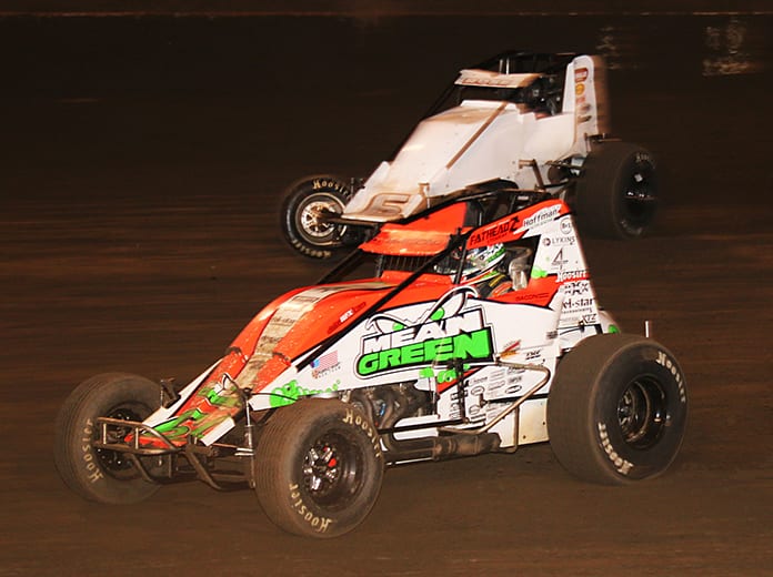 Brady Bacon (69) passes Bill Rose during Friday's Oval Nationals feature at Perris Auto Speedway. (Doug Allen Photo)