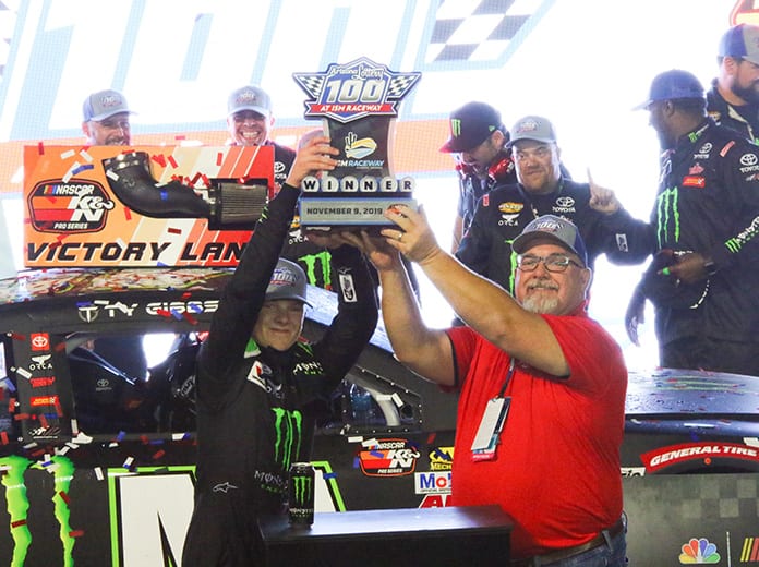 Ty Gibbs hoists the trophy after winning Saturday's NASCAR K&N Pro Series West finale at ISM Raceway. (Ivan Veldhuizen Photo)