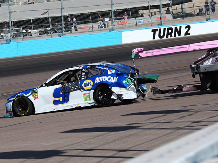 Chase Elliott's car is hauled away by a wrecker after a crash Sunday at ISM Raceway. (Ivan Veldhuizen Photo)