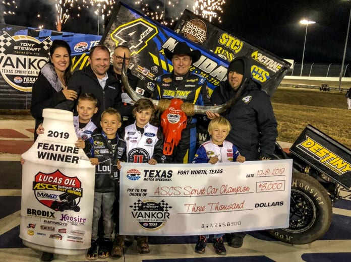 Terry McCarl poses in victory lane with his family and crew after winning night one of the Texas Sprint Car Nationals. (Gabe Flores Photo)