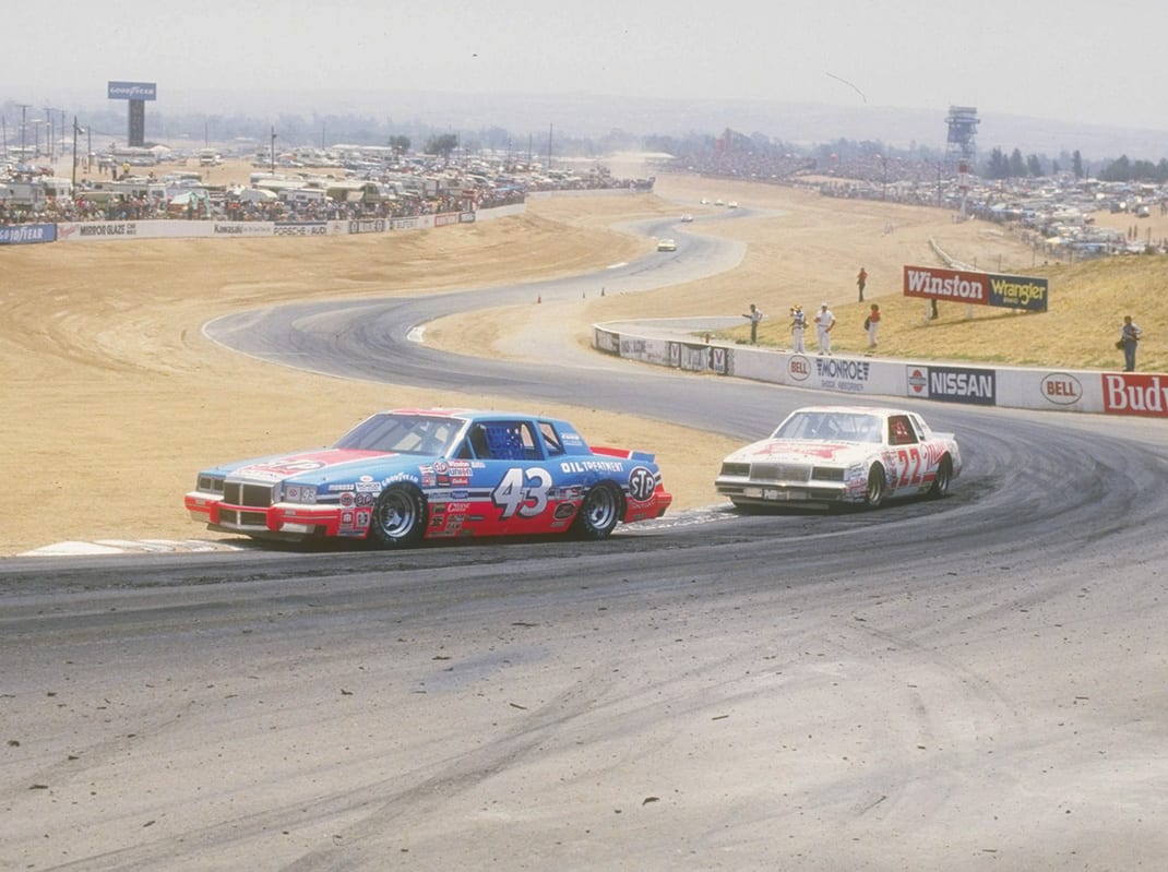 Richard Petty, driver of the #43 STP car is chased by Bobby Allison #22 during a Nascar Winston Cup race at the Riverside Raceway in Riverside, California. (Image by Mike Powell/Getty Images)