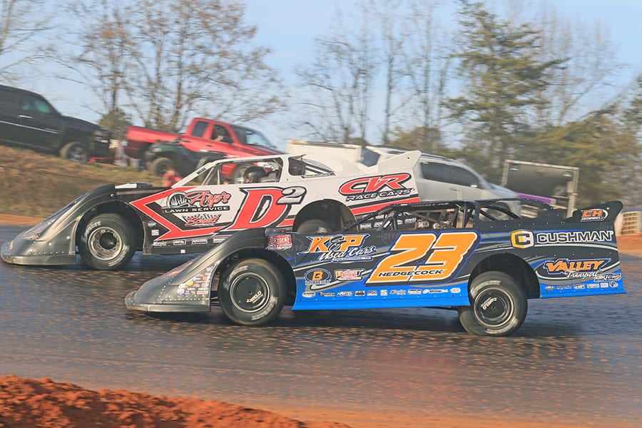 Cory Hedgecock (23) challenges Riley Hickman for second during the Hangover super late model feature on Saturday at 411 Motor Speedway. (Chad Wells Photo)